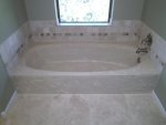 Before and after photos of resurfaced and refinished bathtubs in Austin, Texas.