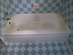 Before and after photos of resurfaced and refinished bathtubs in Austin, Texas.