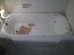 Before and after photos of resurfaced and refinished bathtubs in Austin, Texas.
